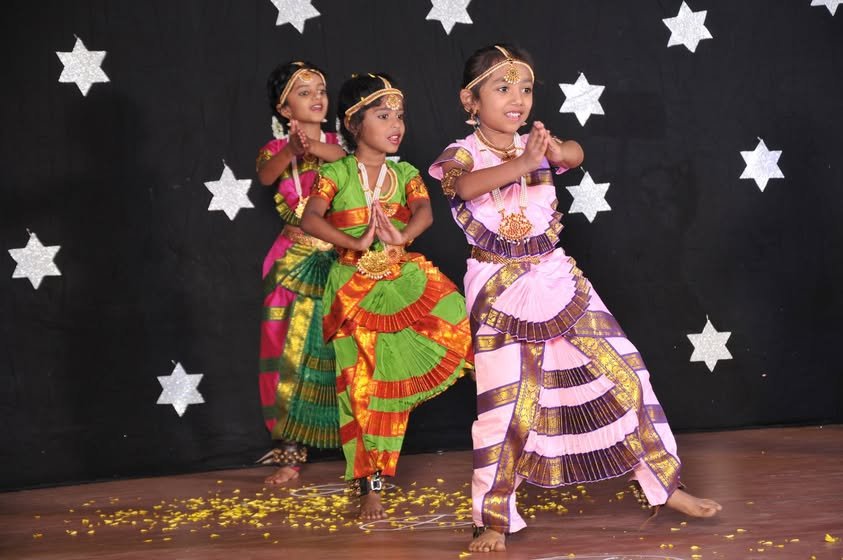 Young students performing a traditional dance at the annual day celebration