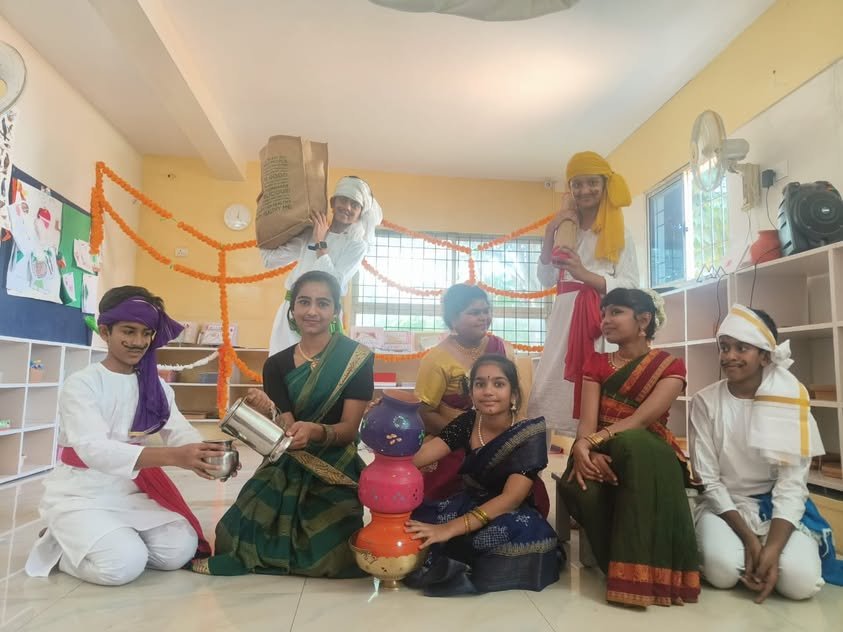 Students in traditional dress during a classroom celebration