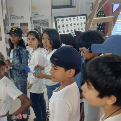 Vidyaramba students exploring exhibits during an educational trip