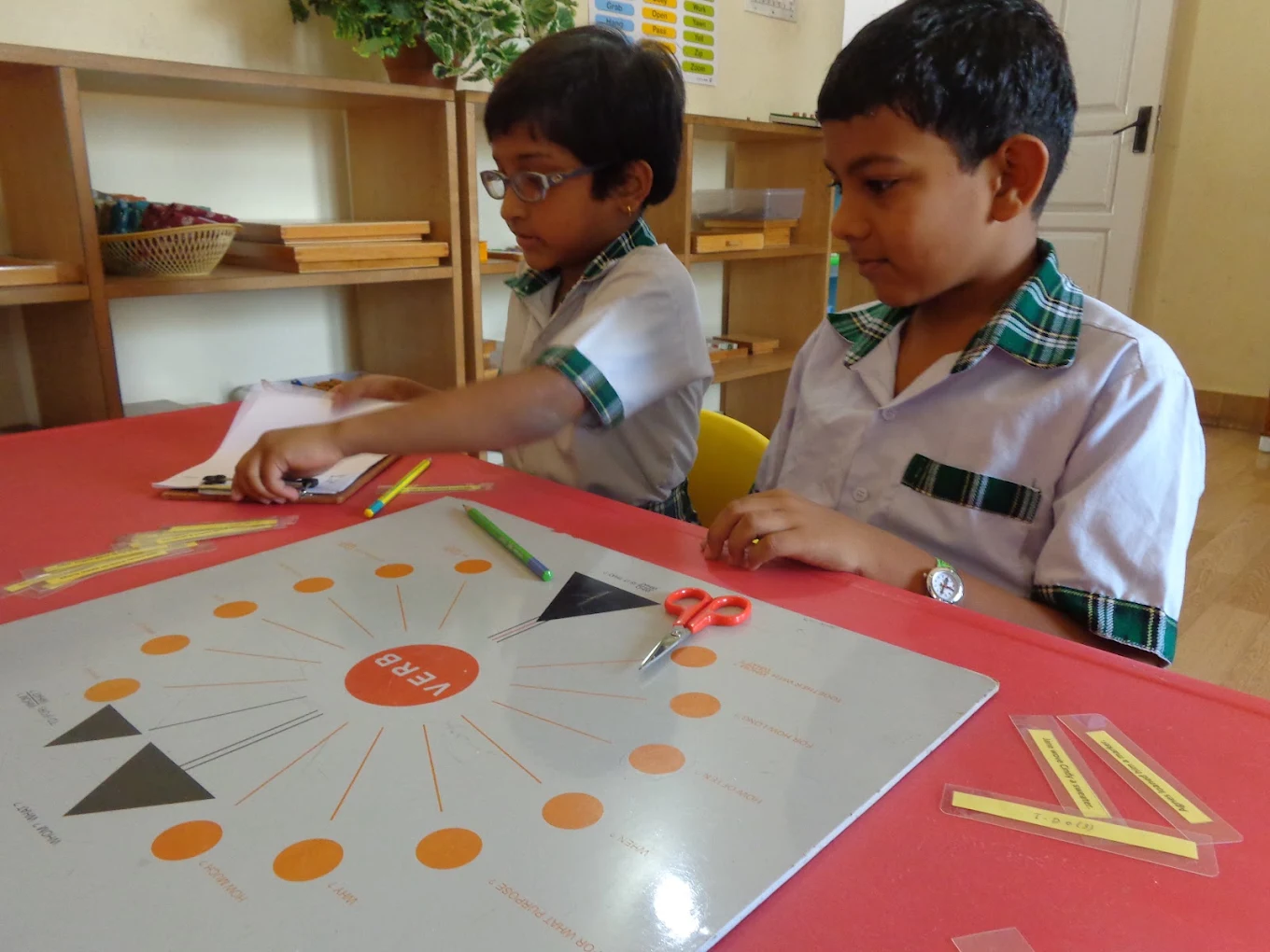 Vidyaramba students working with a hands-on Montessori language activity in the classroom